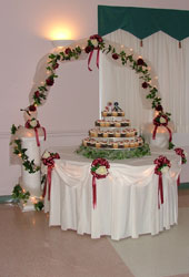 Cake table with Roman Columns and Wrought Iron Arch
