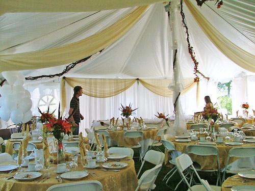 decorated tent with tables and dishes